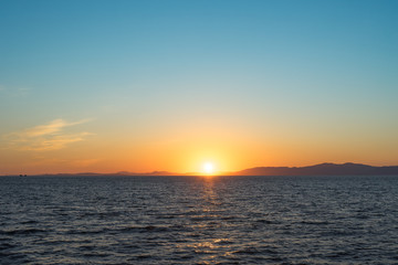 Seascape with beautiful sunset and sunset on the horizon.