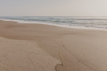 beautiful sand beach with soft ocean wave, wave of the blue sea on the sand bech. concept travel.