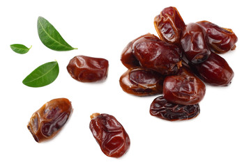 date fruits with green leaves isolated on white background. top view