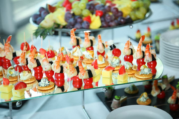 Different fruits and light appetizers provided during catered events. Close-up.