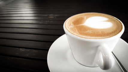 Coffee cup on wood table.
