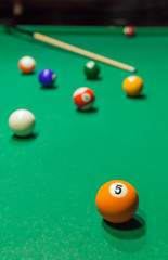 Billiard balls on pool green table