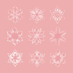 Realistic Christmas snowflakes set isolated on rose gold background