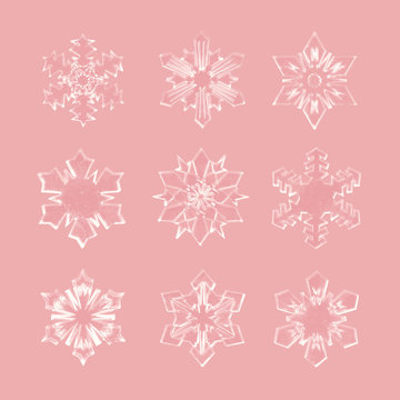 Realistic Christmas snowflakes set isolated on rose gold background