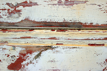 Painted wooden surface white red yellow old peeling