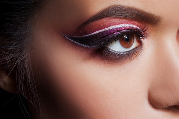 Amazing Bright eye makeup. Eye shadow with a purple tint and an unusual white arrow