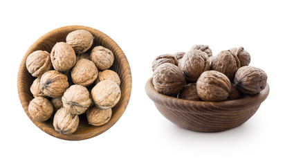 Walnuts isolated on white background. Heap of walnuts isolated on white background. Walnut in a wooden bowl on white background. Walnuts with copy space for text. Two bowls of nuts. Walnuts close-up.