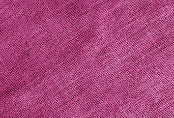 Fototapeta premium Linen cloth texture in pink color.