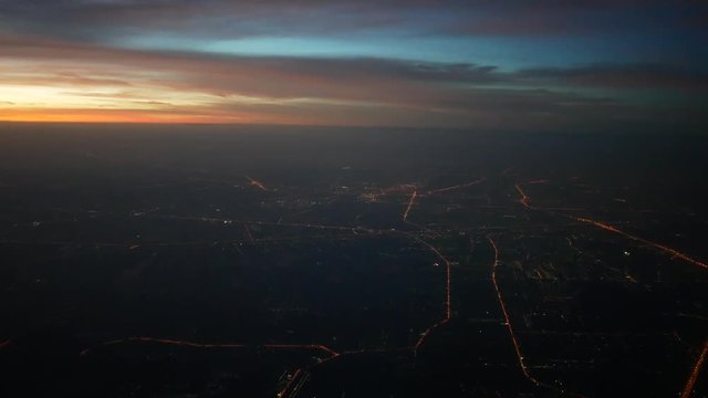 4K footage arial view of flying drone through the city scene during dawn	