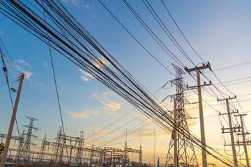 Electricity concept. Close up high voltage power lines station.