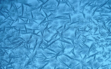 frost crystal on window glass in winter season