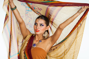 Caucasian brunette woman in brown indian national dress sari