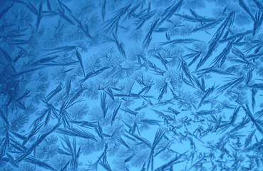 frost crystal on window glass in winter season