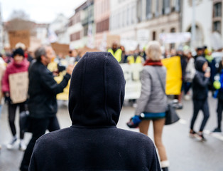Silhouette looking at crowd marching in Central Strasbourg at the nationwide protest Marche Pour Le...