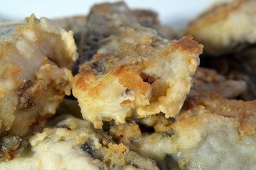 Slices of fish fried in batter close up Shallow depth of field