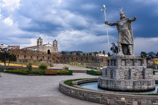 A statue of Inca Pachacutec and Catholic church in the plaza of Vilcashuaman. Ayacucho, Peru