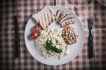 Scrambled egg and bacon on plate