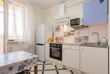 The interior of a small kitchen in the apartment