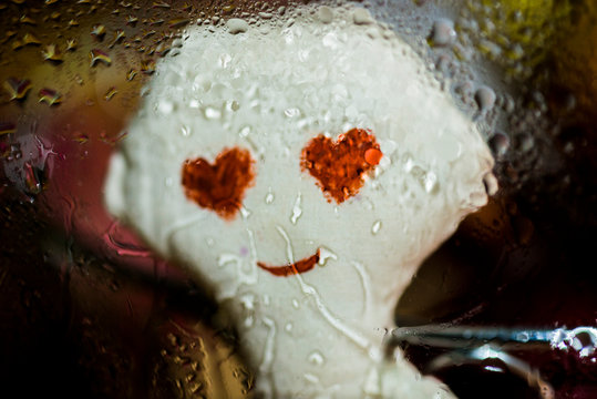 Doll in love outside the window