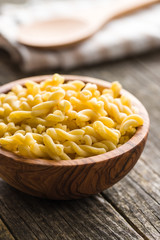 Uncooked gemelli pasta.