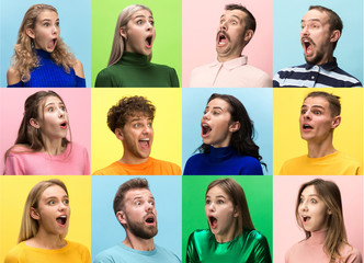 The surprised and astonished young woman and man screaming with open mouth isolated on colorful...