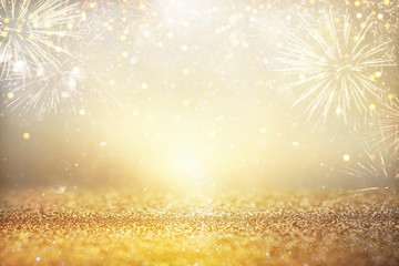 abstract gold glitter background with fireworks. christmas eve, new year and 4th of july holiday...