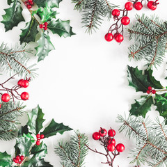 Christmas composition. Frame made of christmas plants on white background. Flat lay, top view, copy...