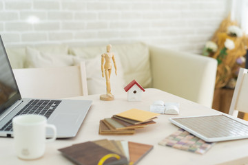 architecture, building, construction, real estate and property concept - close up of hands holding house  model.Home loan property ownership assurance concept