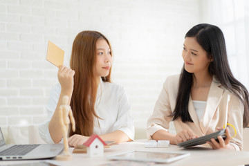 Real estate problem with realtor, lawyer or architect, clients having claim about house construction.business meeting choose the design for built.