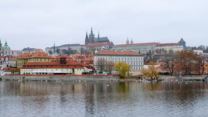 Fototapeta na wymiar Prague Castle with Vltava river view from old town side in autumn season, Czech Republic