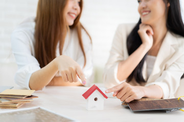 Real estate problem with realtor, lawyer or architect, clients having claim about house construction.business meeting choose the design for built.