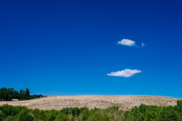 Fortress wall under blue sky at Jiayu Pass, in Jiayuguan, China