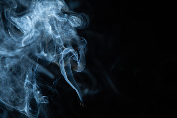 White smoke on black background