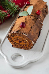 Bush de Noel Christmas Log Cake and New Year background. Copy space.