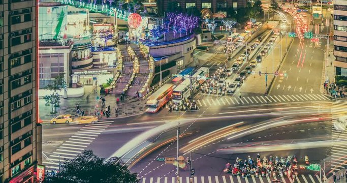 Timelapse of Beautiful night scenery of Taipei 101 Tower and World Trade Center in Xinyi Commercial District during the rush hour