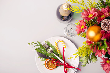 Holiday Christmas table setting. Winter bouquet and natural decoration of tableware