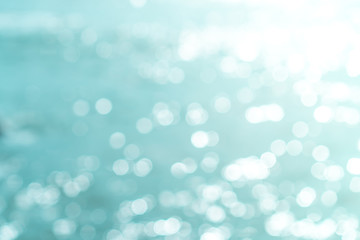 Blur beach with bokeh blue color background.