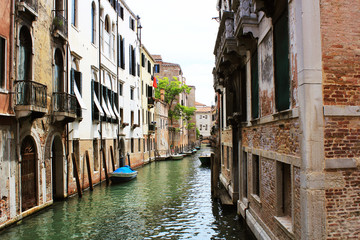 Fototapeta na wymiar Canal in Venice, Italy. Exquisite buildings along Canals.