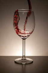 Pouring vine into a vine glass