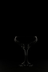 Glass silhouette on black background.