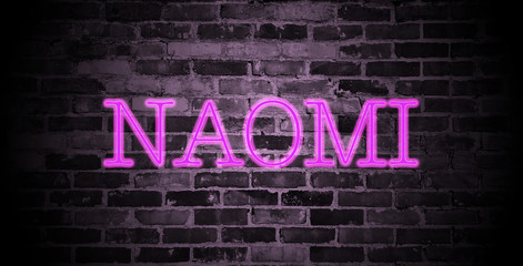 Fototapeta na wymiar first name Naomi in pink neon on brick wall