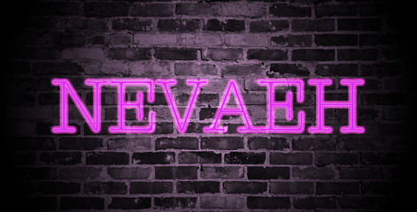 first name Nevaeh in pink neon on brick wall