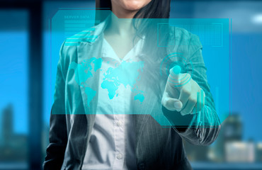 Business woman pointing business data on virtual screen