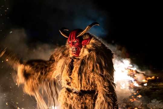 The Krampus masks in an exhibition in the night in Tarvisio, Italy