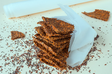 Homemade crunchy bread from flax seeds, Chia, sesame and carrots. Concept-healthy food, vegetarianism, raw food. Selective focus.