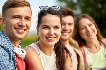 Fototapeta premium leisure, people and friendship concept - happy teenage friends outdoors in summer