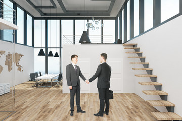 Fototapeta premium Handsome businessmen shaking hands