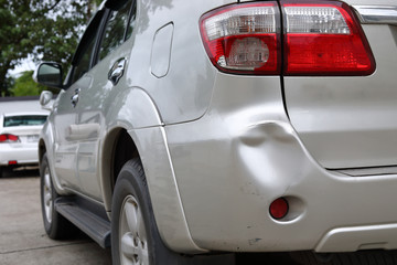 vehicle car bumper dent and taillight broken collision crash damage accident on road - obrazy, fototapety, plakaty