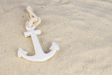 A white anchor in the sand on the beach © Angela Rohde