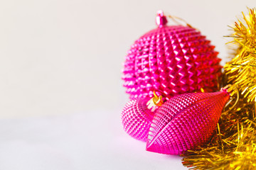 pink christmas toys balls with new year gold tinsel